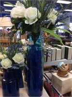Tall blue vase with flowers