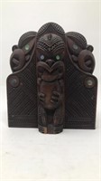One Wooden and Mother of Pearl Tribal Figure