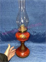 Antique red painted glass oil lamp