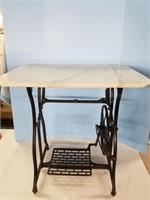The suprise is Marble top Treadle table and jarts