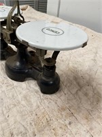 Vintage cast iron scale with porcelain plates
