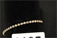 GOLD TONED TENNIS BRACLET WITH CUBIC ZIRC STONES