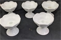 Five milk glass candle holders