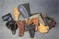 A Huge Pile of Holsters