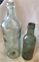 Pair of Vintage Moxie Soda Bottles