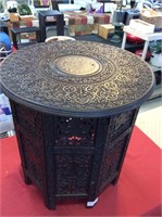 Exotic carved table