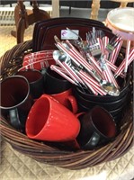 Basket of red holiday dishes and flatware