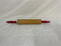 Vintage red handled rolling pin