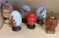 Assorted egg figurines and Hawaii boob statue
