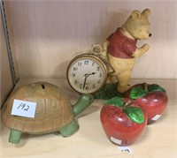 Apple salt shakers,  Winnie the Pooh clock, and a