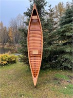 Very nice wooden handmade canoe decorated with bra