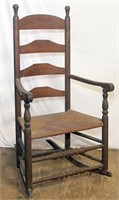 antique ladder back rocker w/woven seat