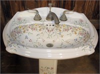 highly decorated porcelain pedestal lavatory. sink