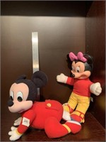 Mickey (crawling ) and a stuffed Minnie