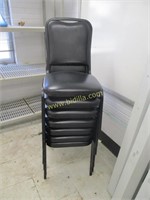 Seven Padded Stacking Chairs