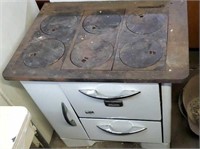 Antique wood Cook stove. While enamelware marked