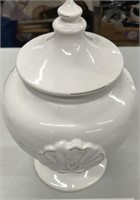White urn w/ shell pattern