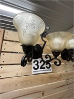 2 lighted sconces
