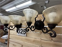 2 lighted sconces