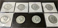 Lot of 8 Kennedy Half Dollar Coins 1965,66 &67)