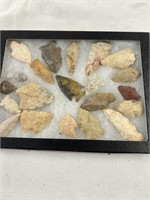 Ancient Native American arrowheads in display