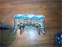 ornate cast iron framed foot stool