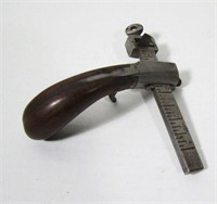 Lot 142   Antique Rosewood - Leather Draw Gauge.