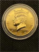 Gold-plated Kennedy Half Dollar coin