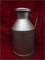Small steel milk can. Painted.