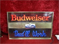 Lighted Budweiser beer sign.