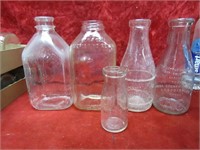 (5)vintage milk bottles.