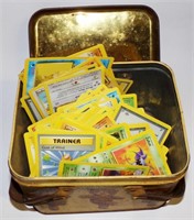 Assorted Pokemon Cards In a Vintage Tin