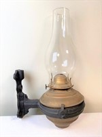 antique oil lamp w/ cast iron bracket