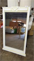 large white wall mirror with yellow trim