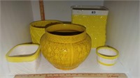 5 yellow ceramic pots
