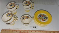 yellow floral cups and saucers