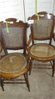 pair of cane back and seat dining chairs w/arms