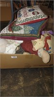 box of stuffed animals and pillows