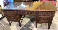 Antique highly carved desk with 3 drawers in the