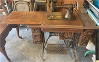 Antique Singer sewing machine in the original oak