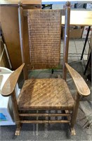 Large vintage rocking chair with a woven seat and