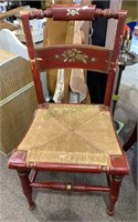 Antique red painted side chair with a woven rush