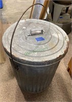 Small galvanized metal vintage trash can with the