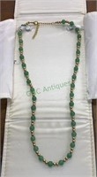 20 inch gold tone and jade-like beaded necklace,