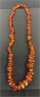 Amber stone necklace measures 22”.  (1578)