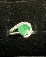 Sterling silver ring marked 925 with green