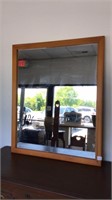 Mirror in solid wood frame.  Measures 28x34. T