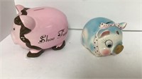 Two pig ceramic piggy banks, one pink says (shoe