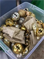 Large tub of gold and silver Christmas ornaments