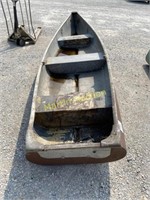 old patched up canoe